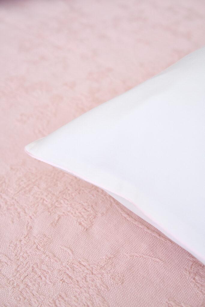 NOMO Solène bedding detail in Ivory and Powder with fine piping
